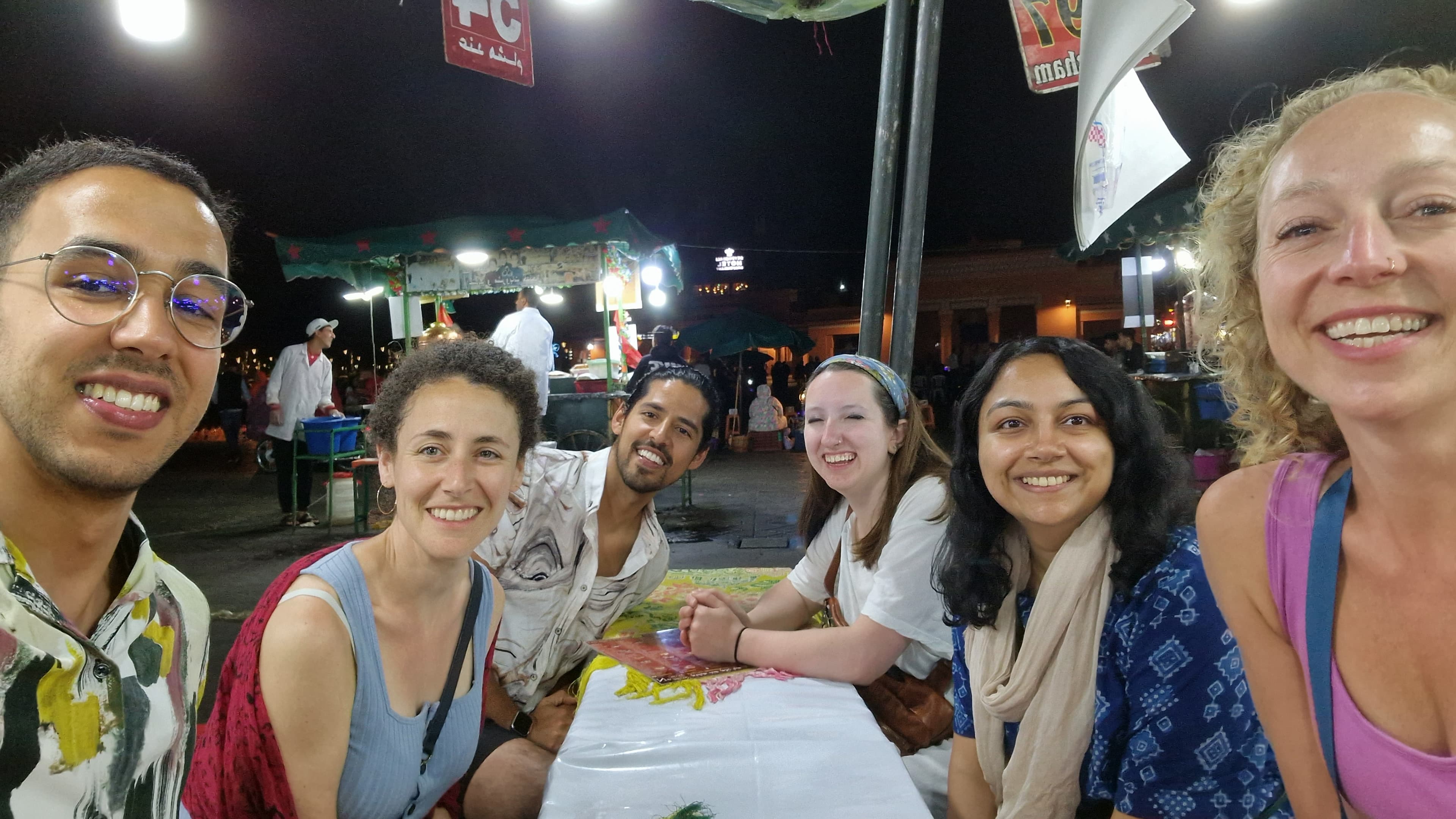 American colleagues traveling Morocco with local guide Mahmoud in Marrakech medina